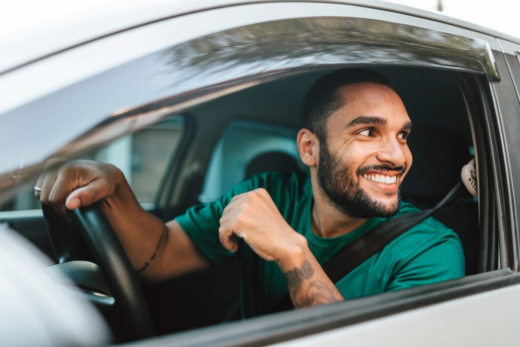 Smiling driver at the wheel